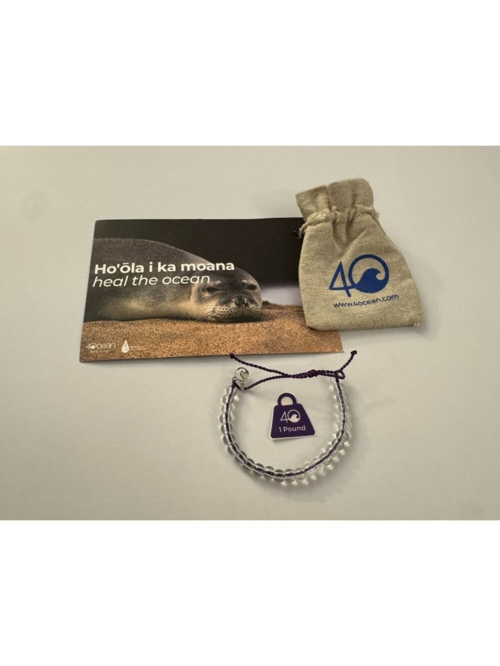 4ocean Heal The Ocean Seal Beaded Bracelet Clear Plastic Cord Adjustable EB3